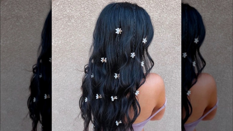 Daisy clips in dark hair
