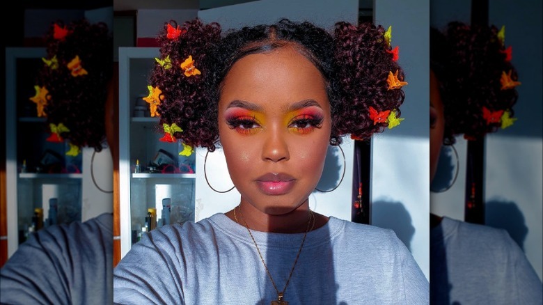 Woman with space buns and butterfly clips