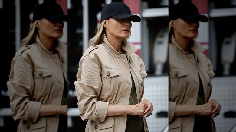 Melania Trump in an athletic cap with a sporty trench