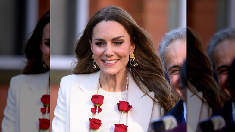 Kate Middleton wearing natural makeup and statement earrings