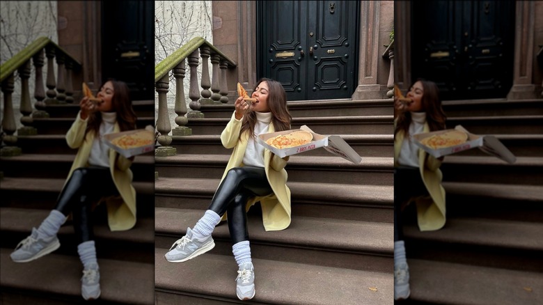 Woman in leather leggings and sneakers