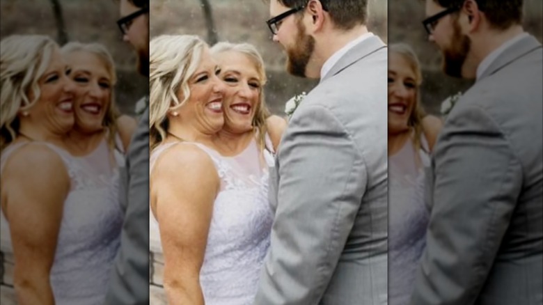 Abby and Brittany Hensel smile in wedding photos with husband Josh Bowling