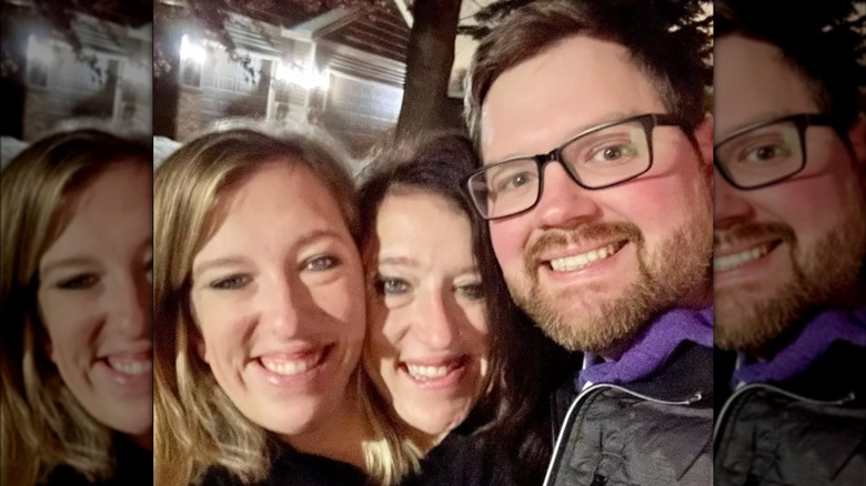 Brittany and Abby Hensel smile in a selfie with Josh Bowling