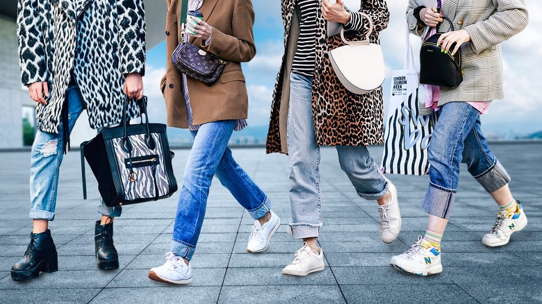 4 women wearing cuffed jeans