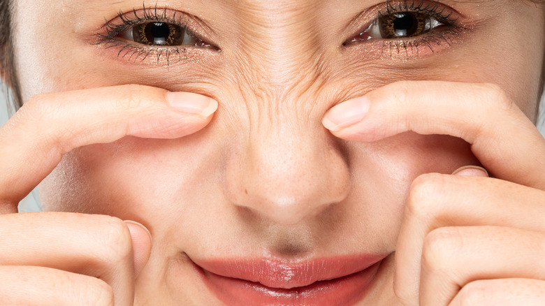 Person scrunching nose 