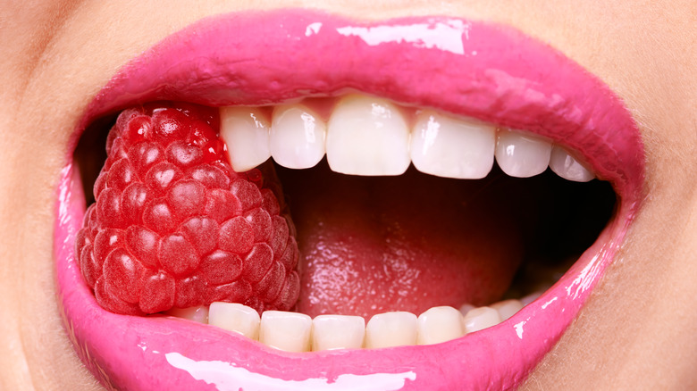 Woman with glossy pink lips