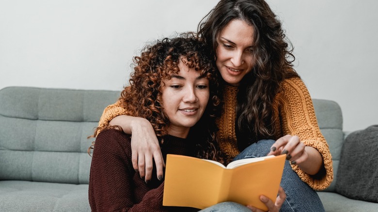 couple reading book together