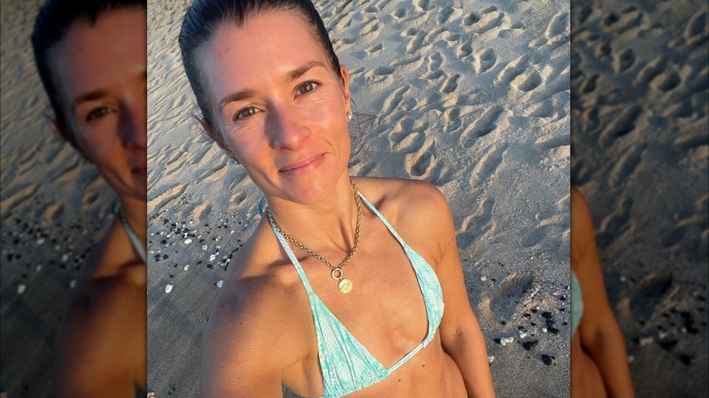 Danica Patrick posing for a makeup-free selfie on the beach