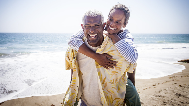 Couple smiling on the beach
