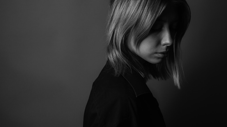 Black and white image of an isolated woman