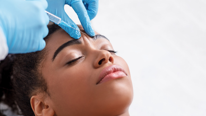 Black woman gets syringe injection