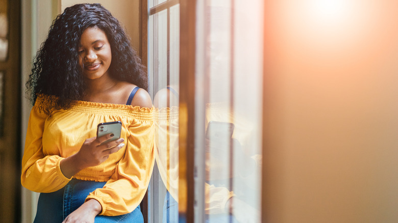 smiling woman on a phone