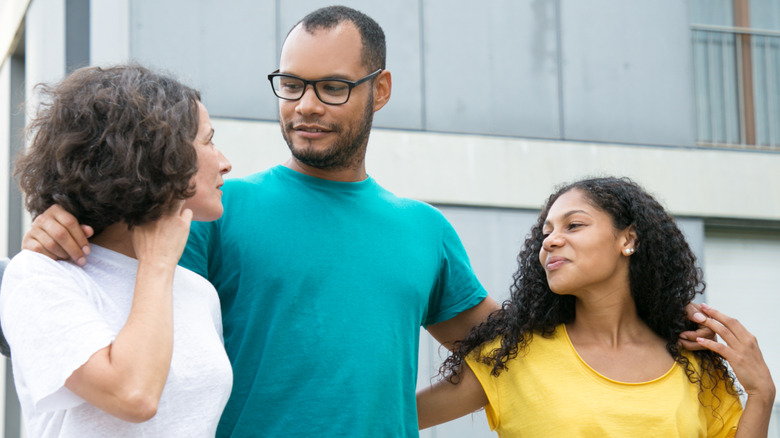 two women and one man