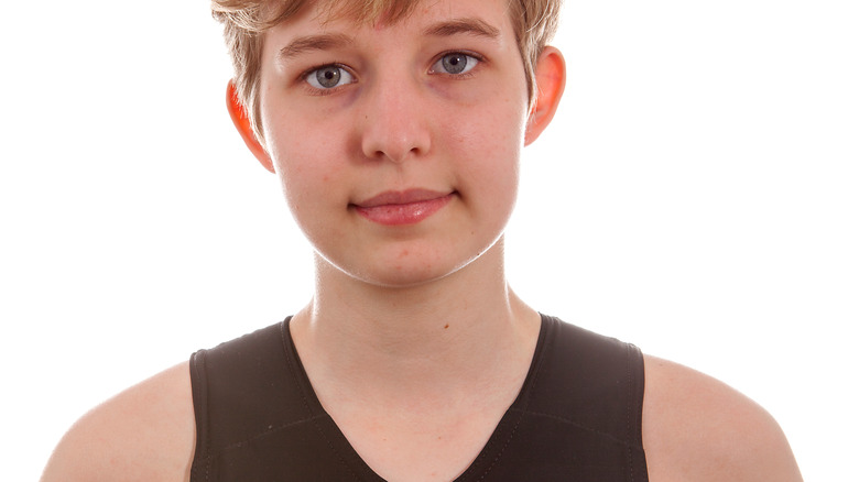 trans teen wearing chest binder