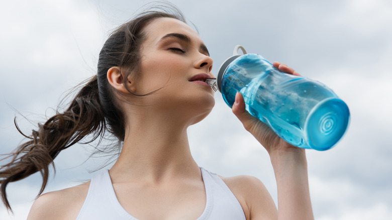 Girl drinking from a water bottle