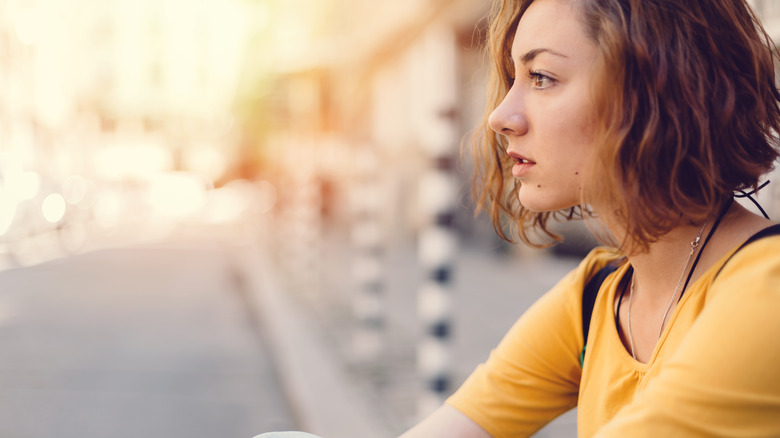 Woman staring blankly
