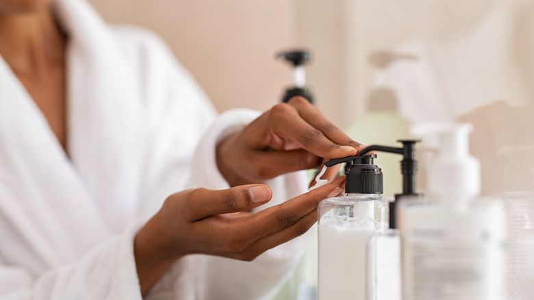 woman dispensing cream 