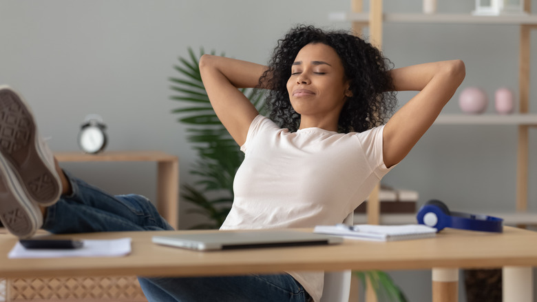 Woman reclining with eyes closed