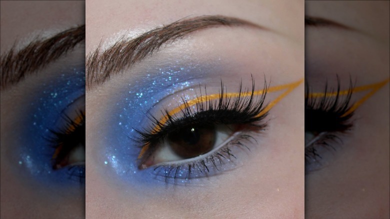 person wearing negative space eye-makeup