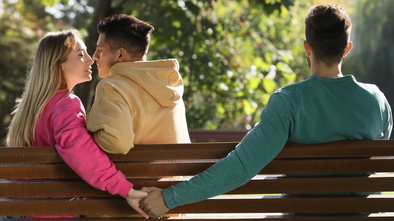 cheating partner holding hands