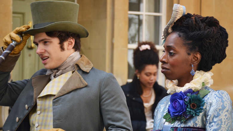 a man and a woman in Victorian costume