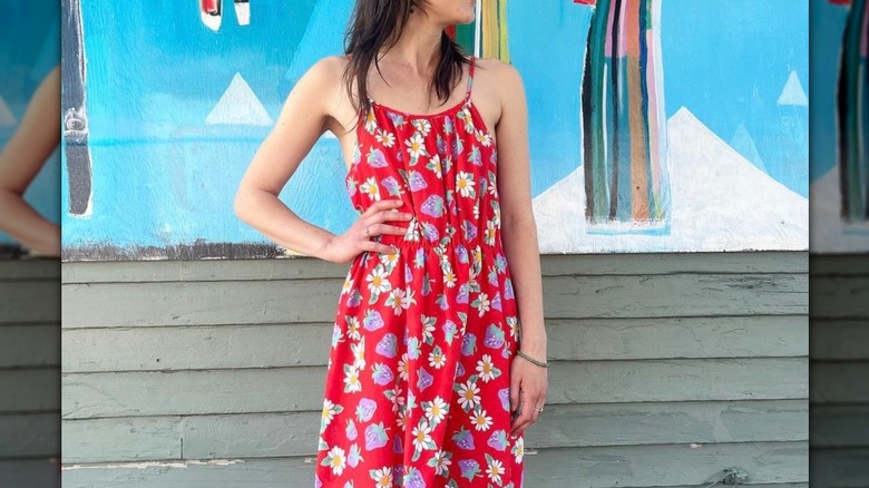 Woman wearing red strawberry dress
