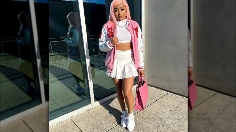 Influencer wears preppy pink outfit