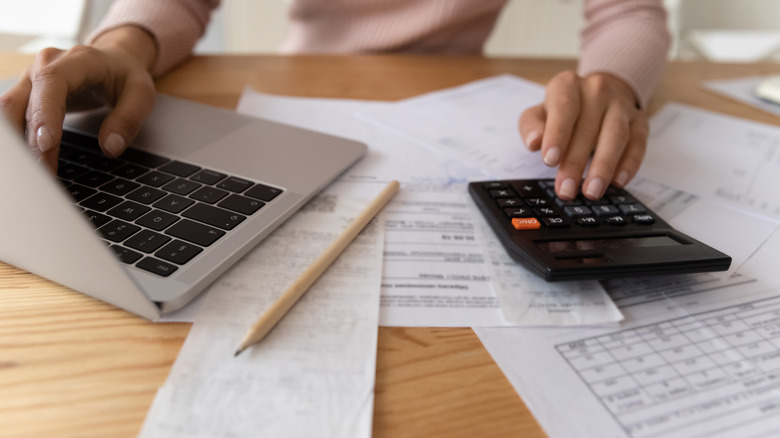 woman calculating medical bills