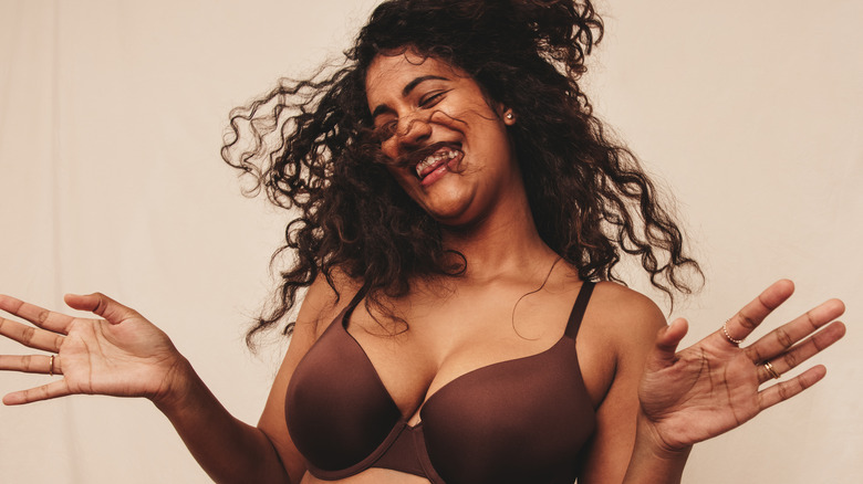 Woman laughing in her underwear