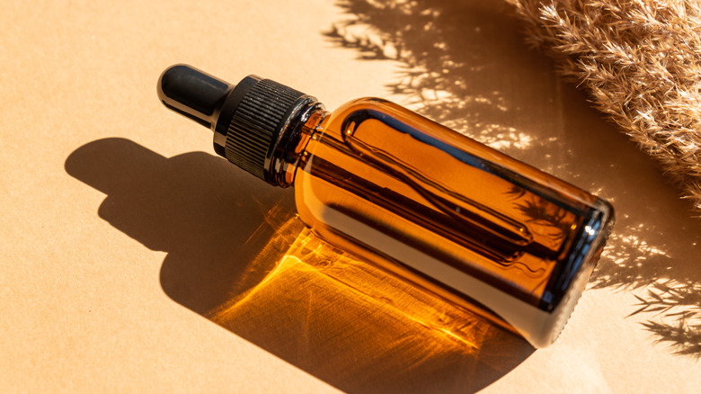 dark serum bottle with dropper