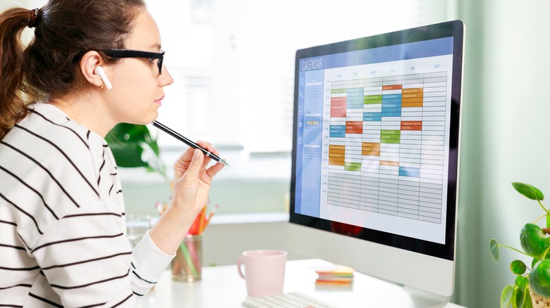 woman looking at schedule