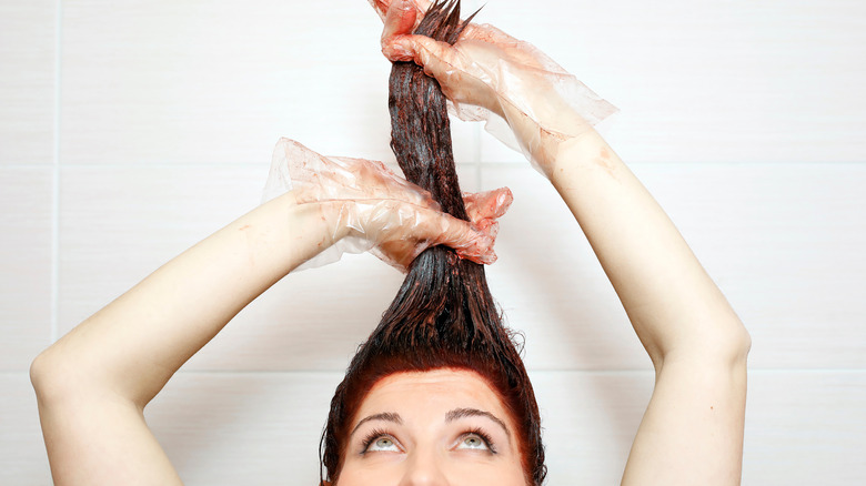 woman dyeing hair red
