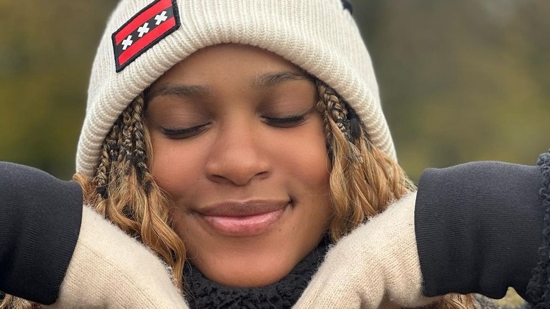 Rebeca Andrade wearing gloves and beanie