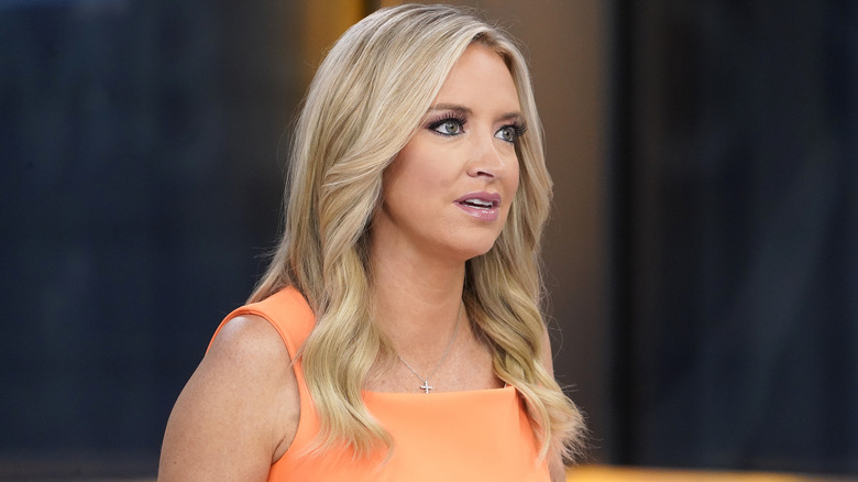 Kayleigh McEnany conducts an interview while sitting on a couch