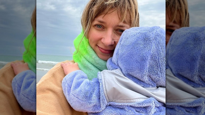 Lauren Lapkus with her baby posing in a selfie at the beach