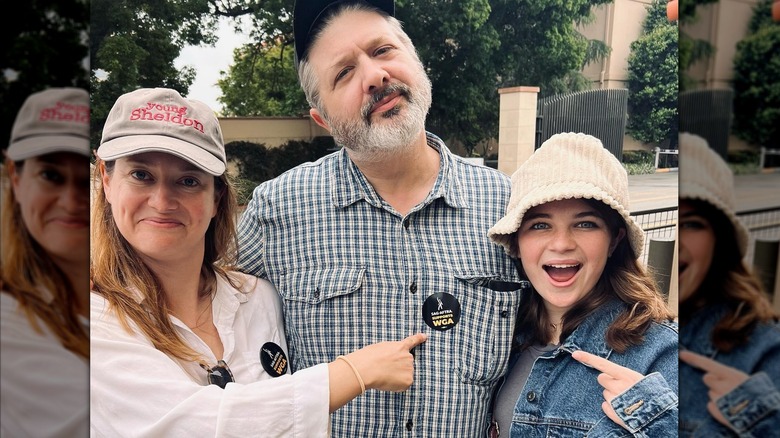 Zoe Perry with costars at the Writers Strike in Los Angeles, wearing minimal makeup and a "Young Sheldon" cap