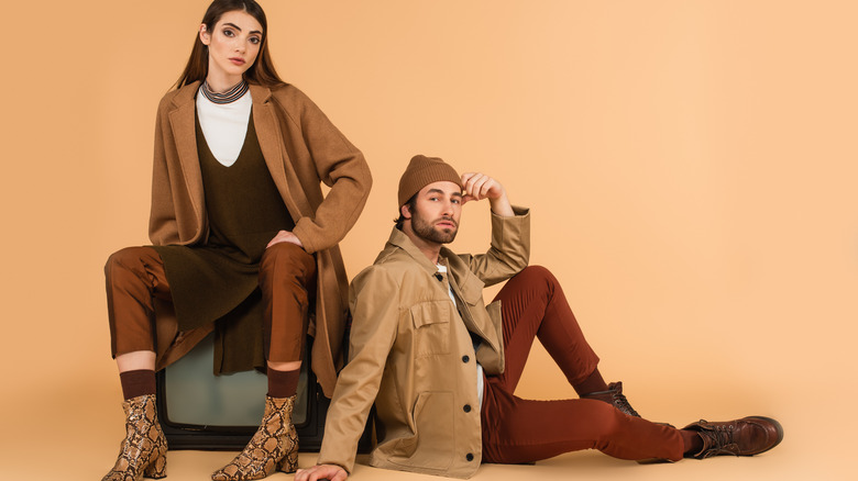 two people modeling coats