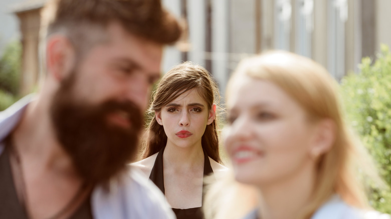 woman watching a couple