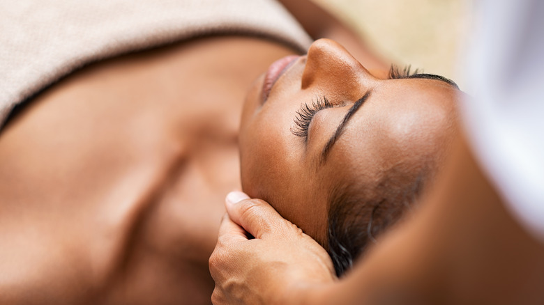 Woman having her head massaged