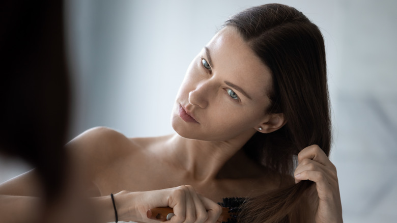 woman brushing her hair