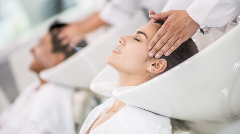 woman getting hair treatment