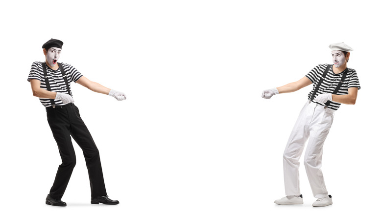 mimes playing tug of war