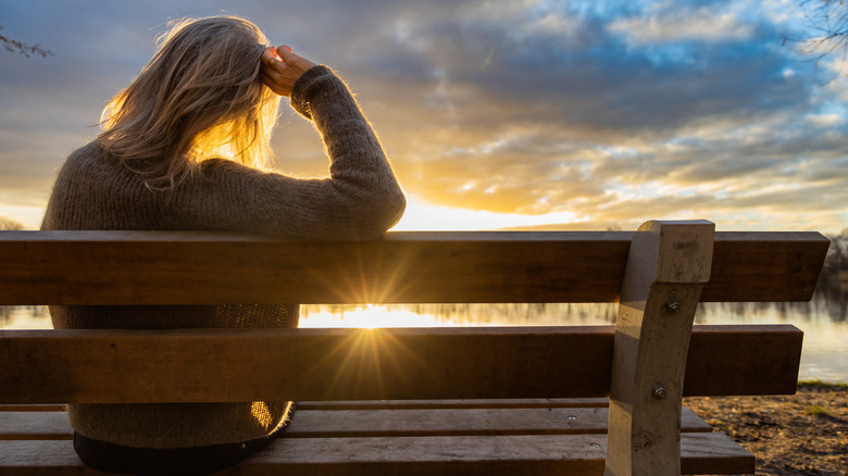 woman sitting on bench