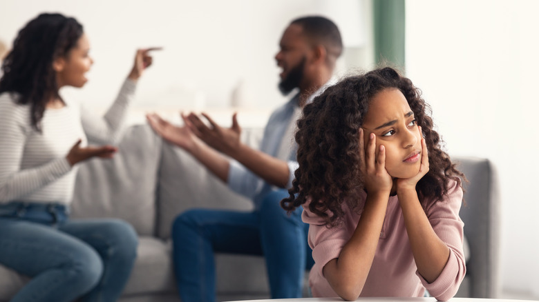 Kid sad parents arguing