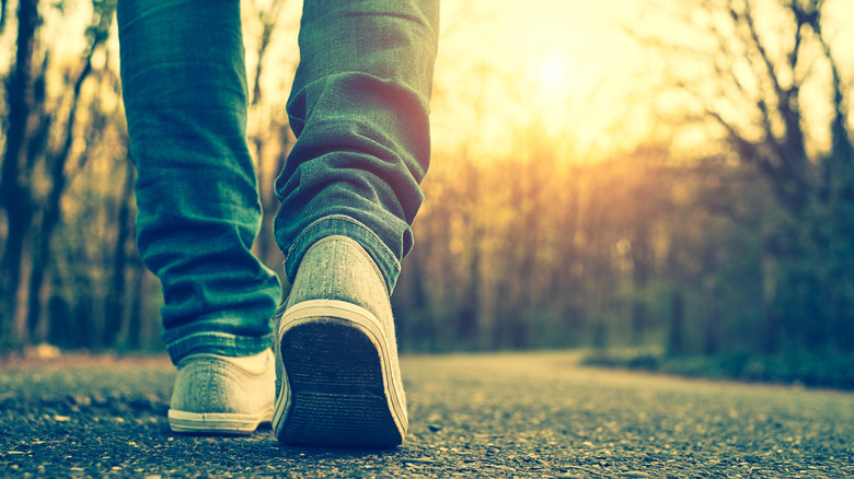 feet walking on park path