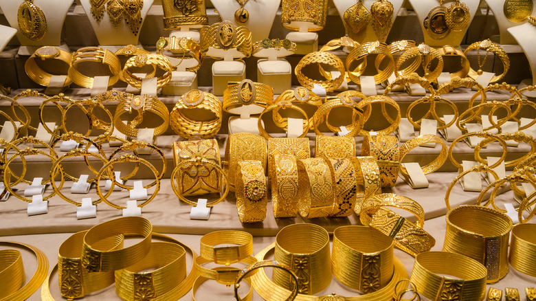 Golden jewelry and arm cuffs