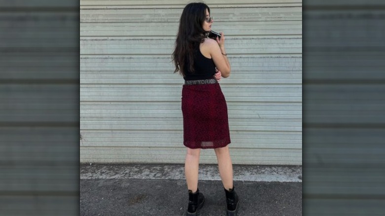 Woman wearing skirt with boots