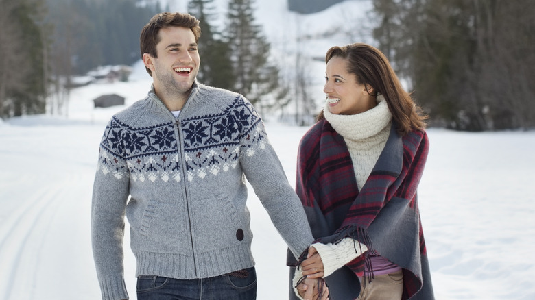couple walking in the snow