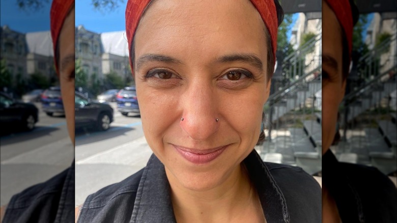 Woman with double-nostril piercing