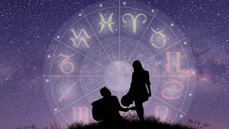 couple under zodiac wheel